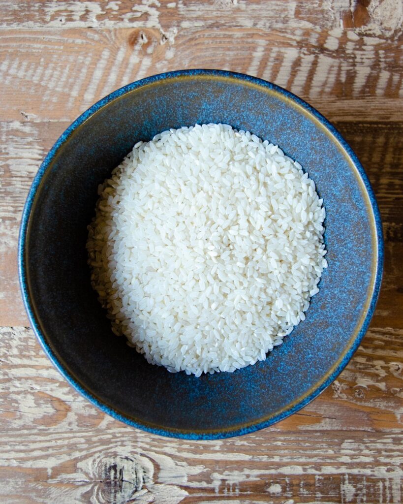 Arborio Rice in a blue bowl.