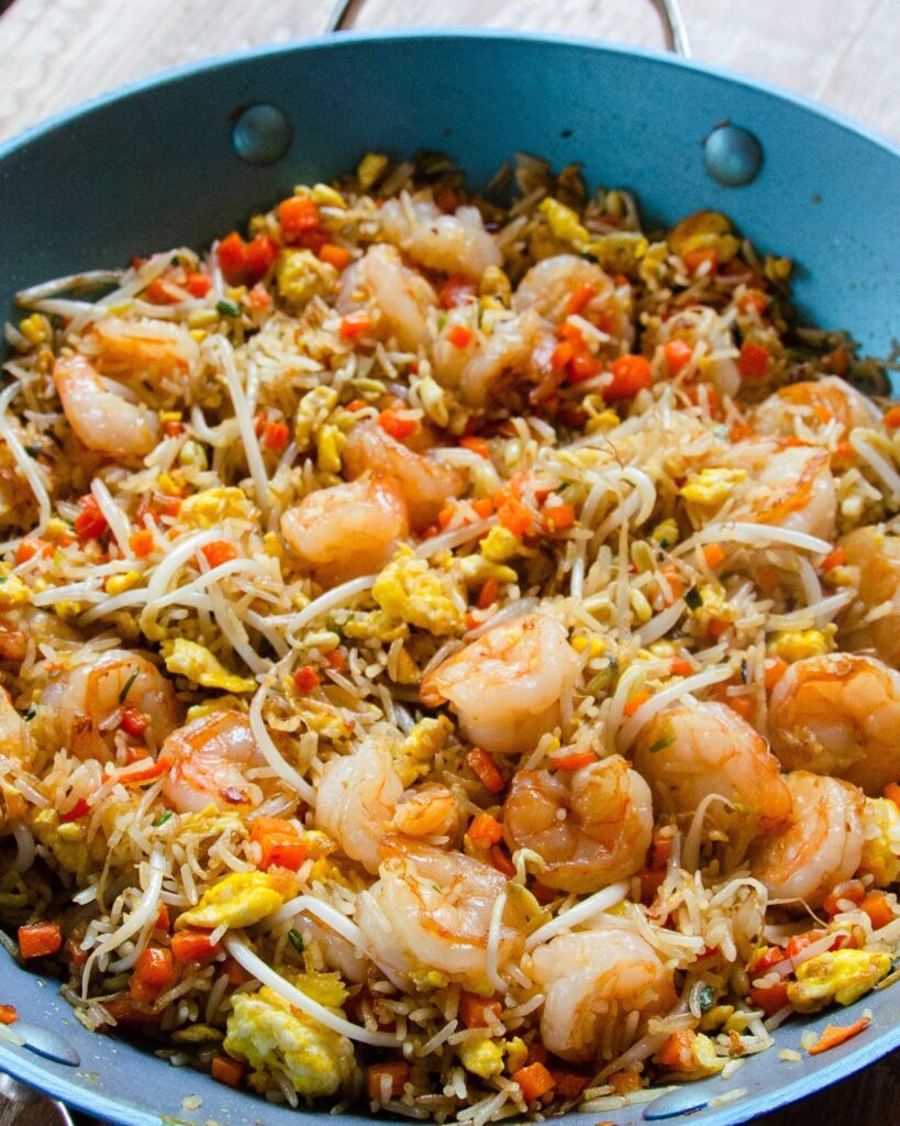 Shrimp fried rice in a blue pan.