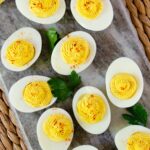 Deviled Eggs on a grey slate platter.