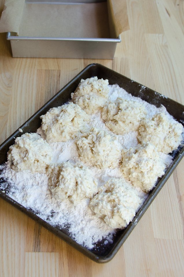 Buttermilk Biscuit batter on a tray with flour.