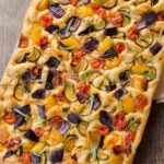 Roasted Vegetable Focaccia with a napkin.