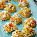 Tostada Bites on a turquoise tray.