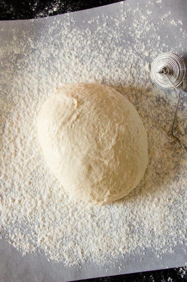 No knead bread turned out onto floured parchment paper.