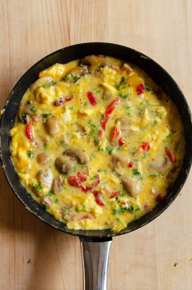 A partially cooked frittata before it goes into the oven.
