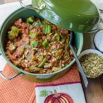 Pork and Pumpkin chili in a green cast iron pot.