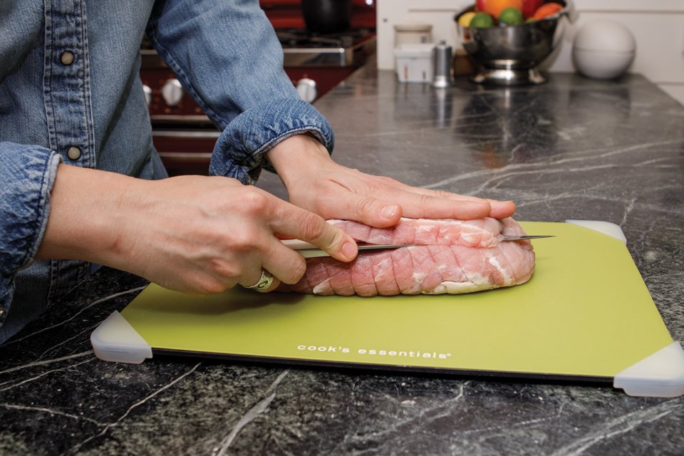 Showing how to double-butterfly a pork loin.