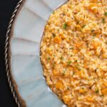 Risotto with Butternut Squash on a blue plate.