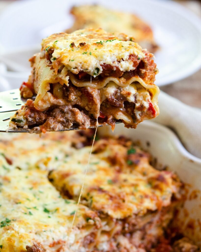 A portion of lasagna roll ups being served.