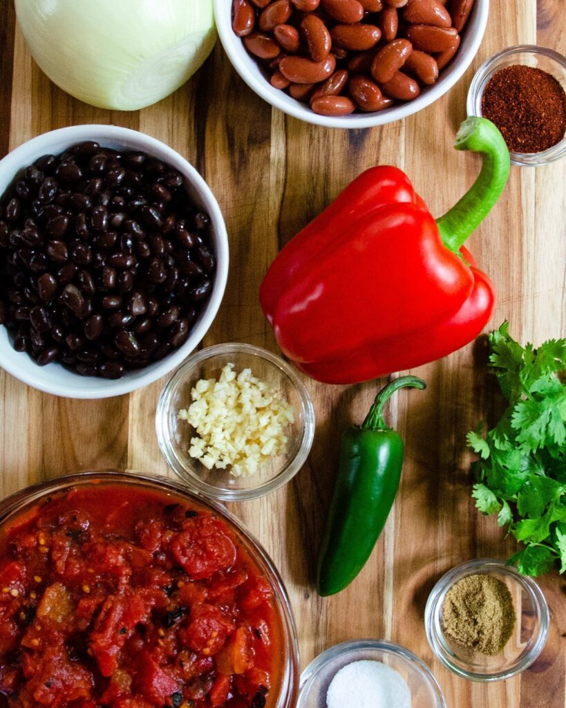 Ingredients for Chicken Tortilla Soup - black beans, pinto beans, peppers, cilantro, tomato and chili powder.