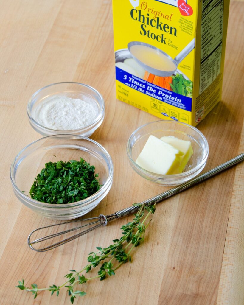 Ingredients for gravy on a wooden board.