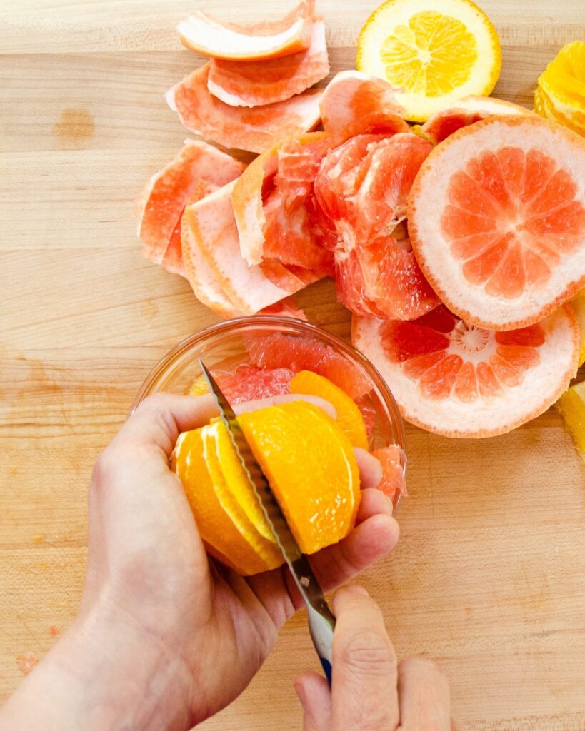 Orange being supreme with grapefruit and orange peel nearby.