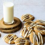 S'mores cookies on a counter with a glass of milk.
