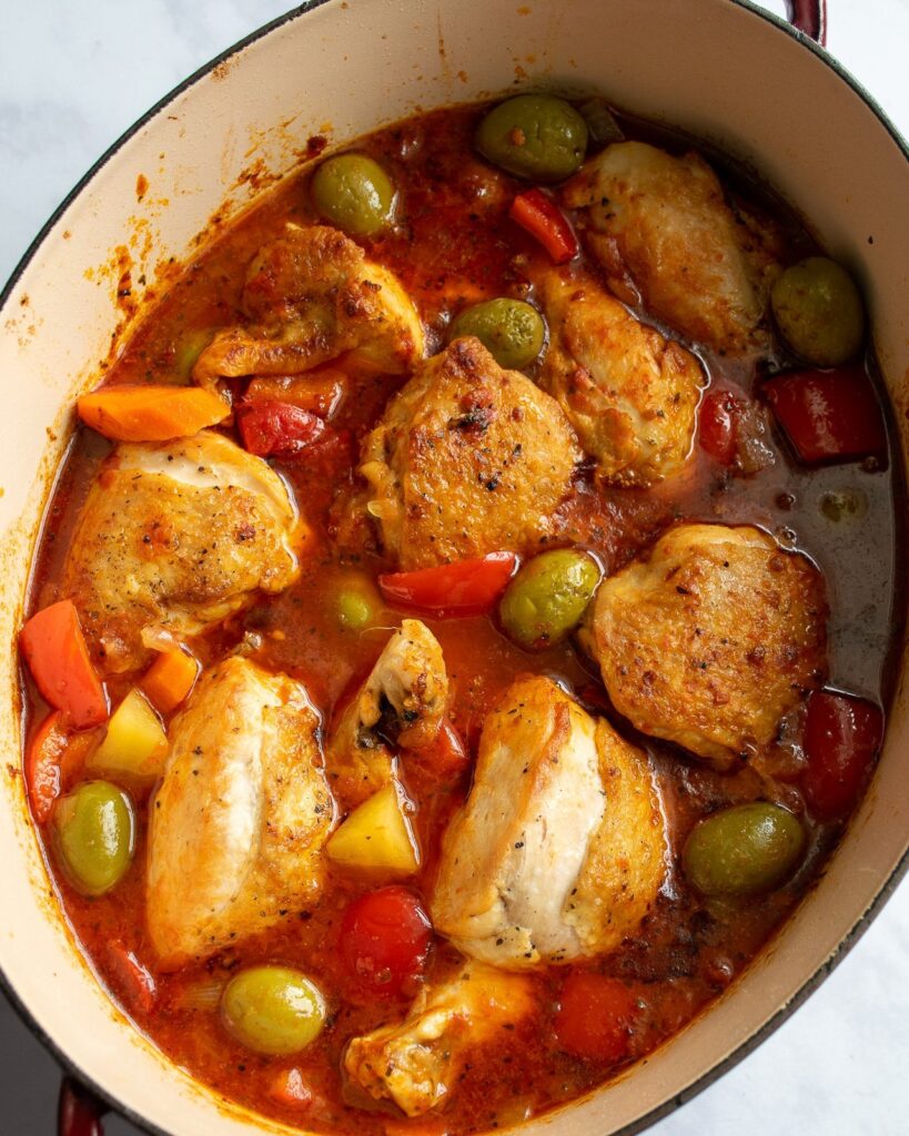 Spanish style chicken stew in a dutch oven.