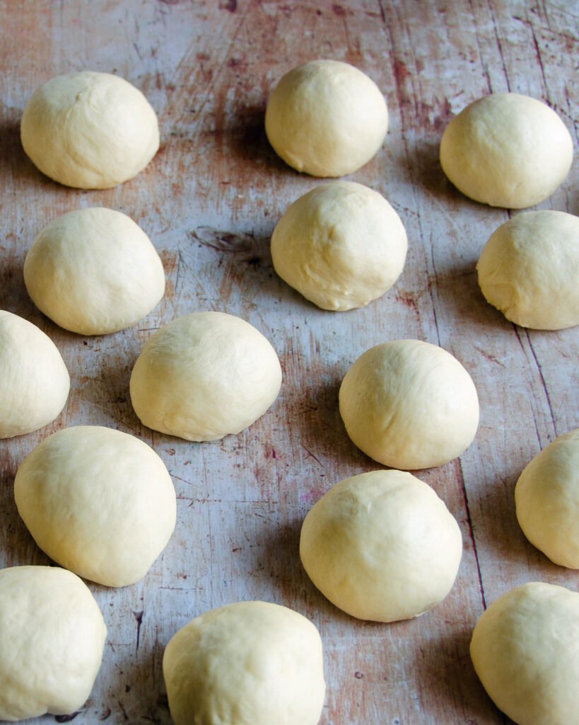 dough balls on a wooden countertop