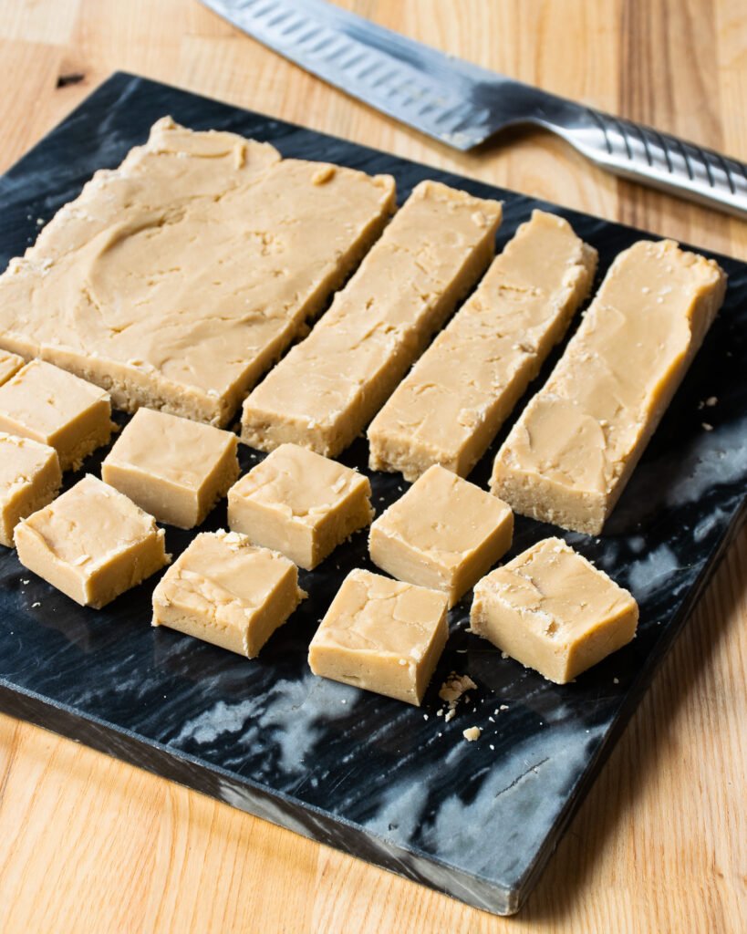 Sucre a la creme in the process of being cut into squares.