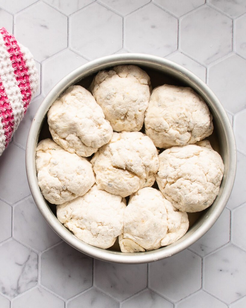 Buttermilk biscuits in a round cake pan.