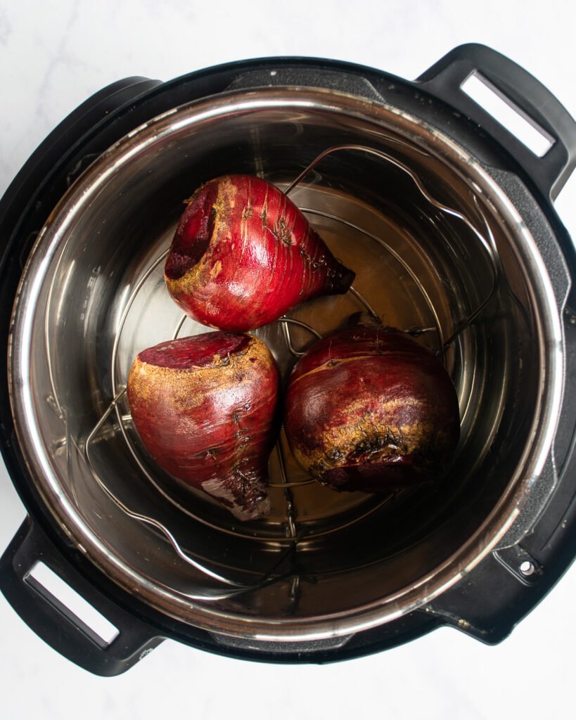 Raw beets in a pressure cooker.