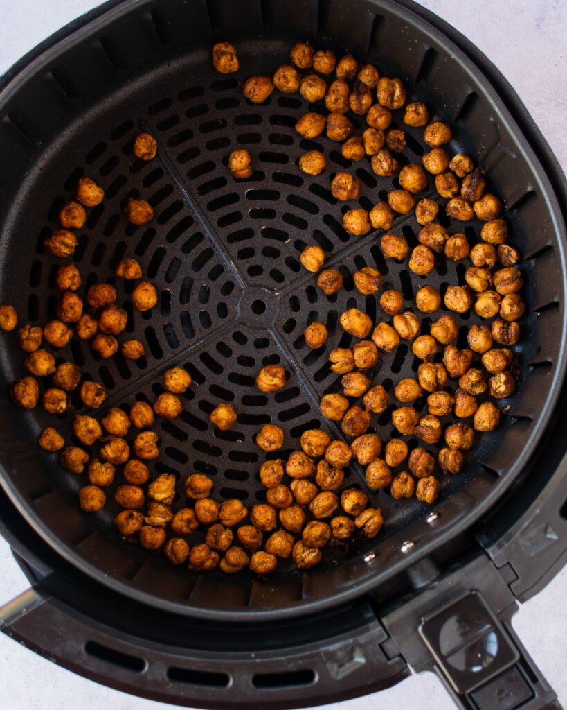 Chickpeas roasting in an air fryer.