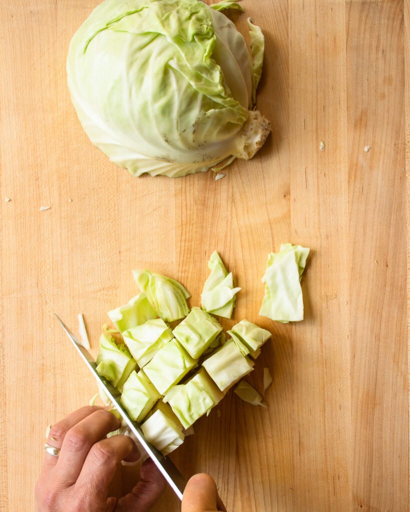 Cutting dice of cabbage with a chef's knife.