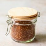 Best dry rub spice mix in a glass jar with wooden lid.
